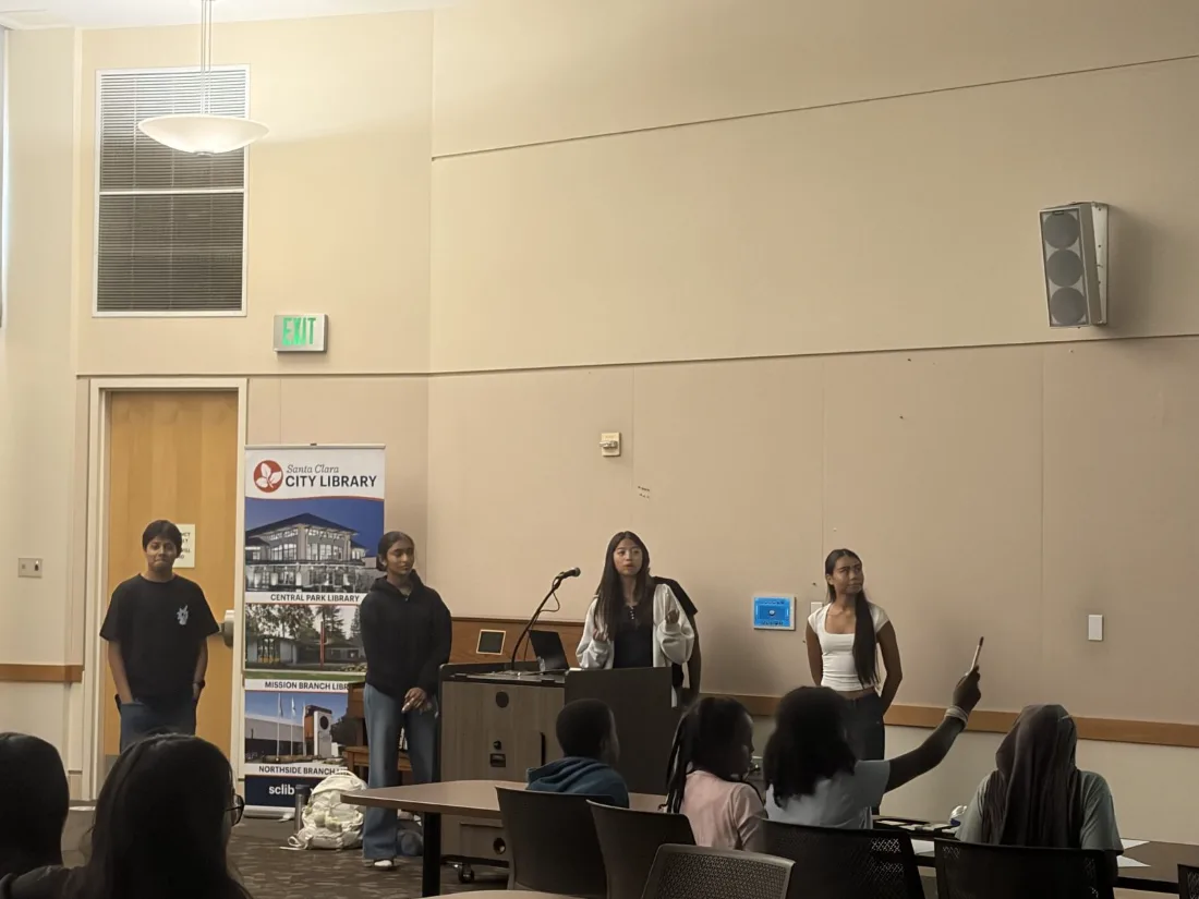 Team answering questions from the room